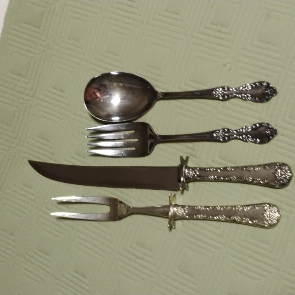 Silver plated carving set & salad set.